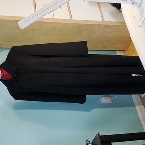 Full length womens coat with removable lining.